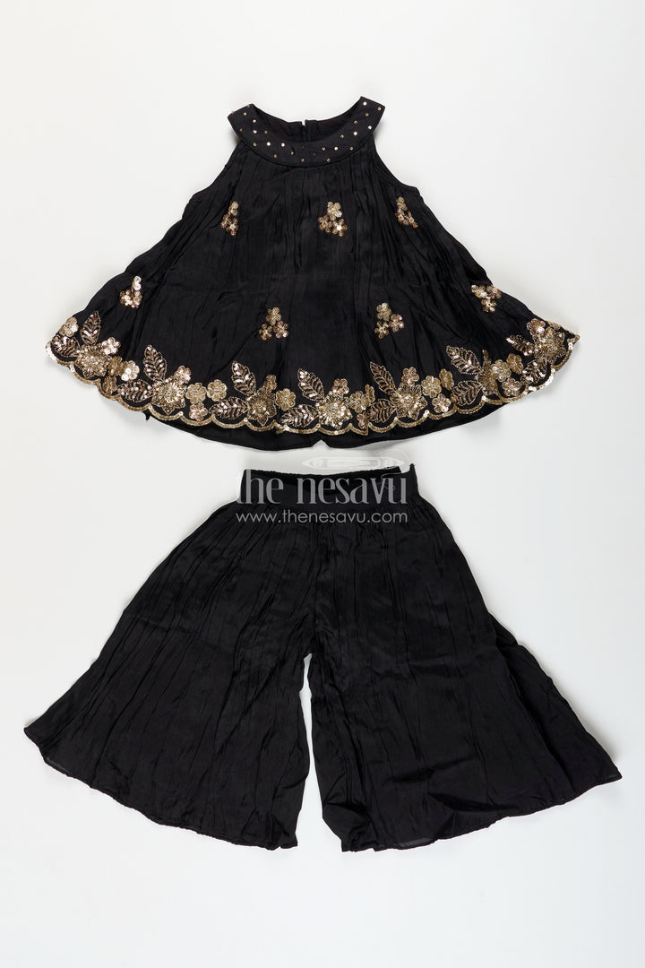Girls black muslin silk sharara set with embroidered kurti for festive wear