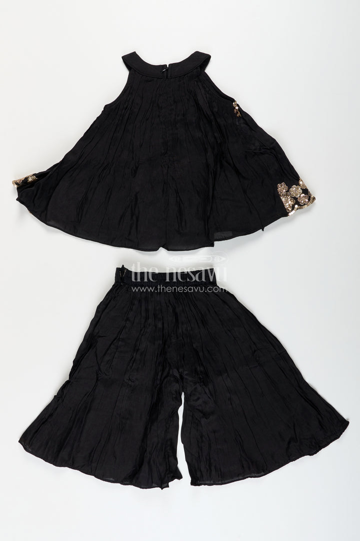 Girls black muslin silk sharara set with embroidered kurti for festive wear