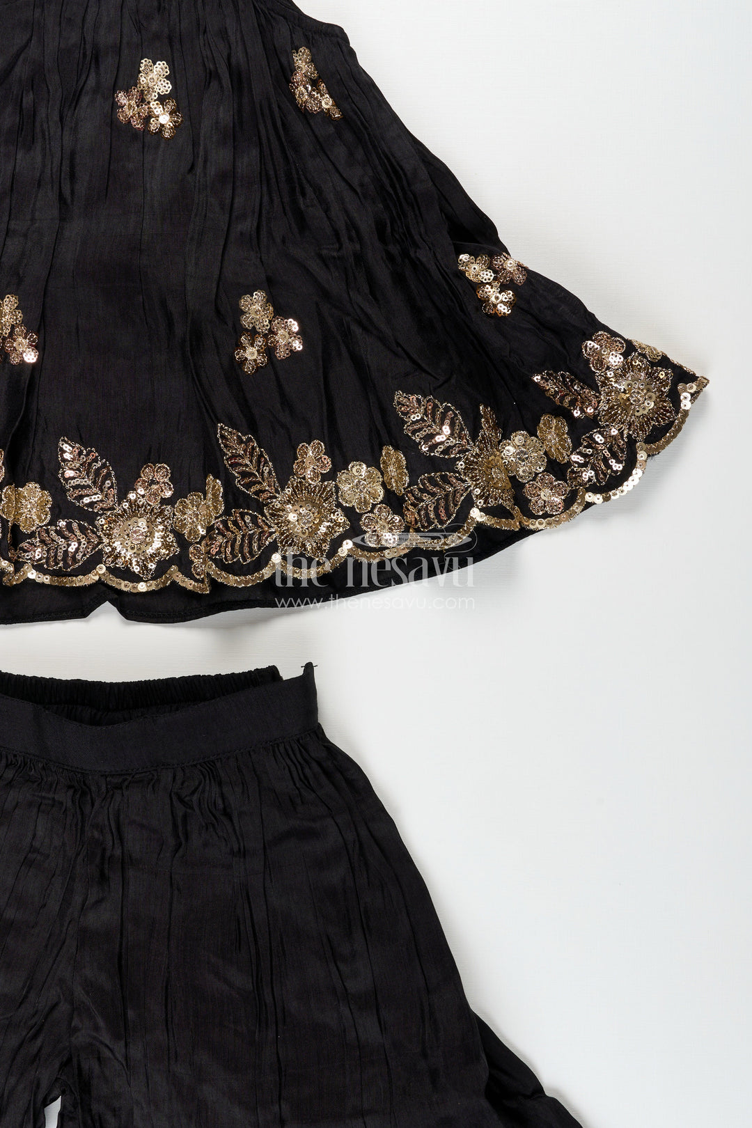 Girls black muslin silk sharara set with embroidered kurti for festive wear