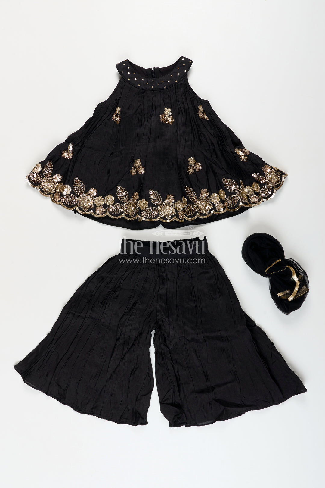 Girls black muslin silk sharara set with embroidered kurti for festive wear