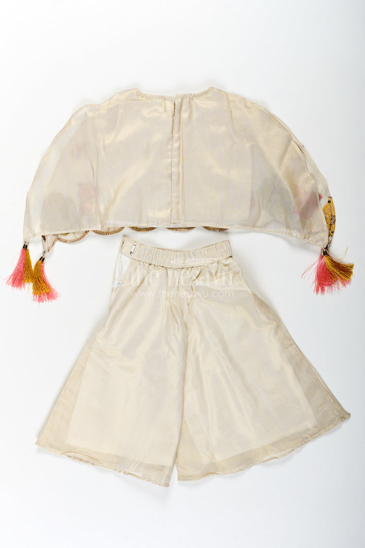 Cream Color Sharara Set for Girls in Shimmer Viscose Silk with Designer Embroidered Cape and Tassels