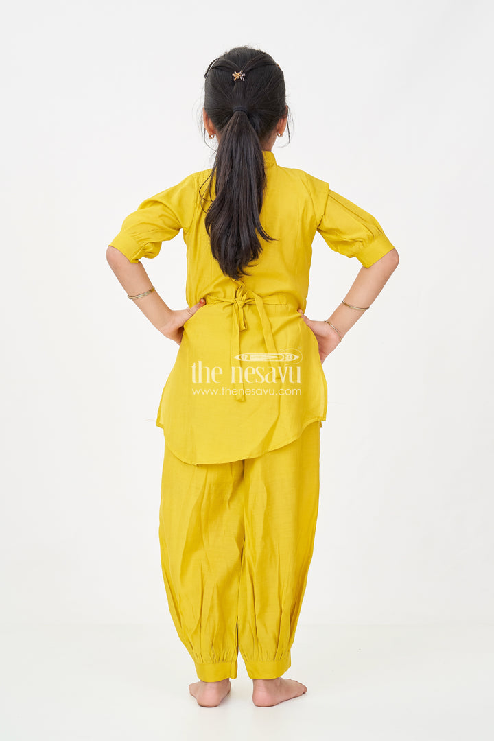 Girls lemon yellow sharara Set in Modal Silk with Artistic Embroidery and Statement Kurti Design