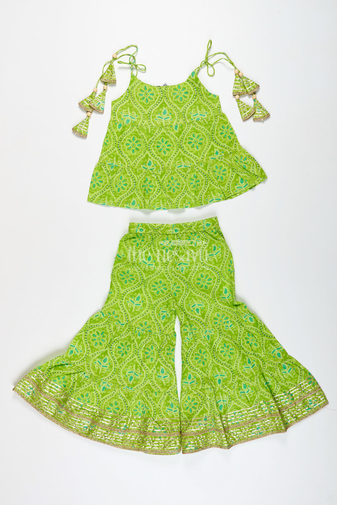 Girls green halter top with ethnic printed skirt for festive occasions