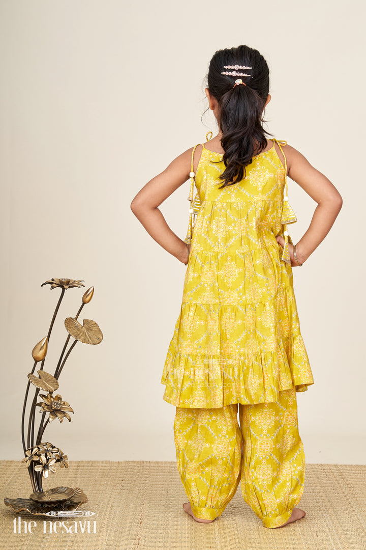 Girls yellow sharara set with printed tiered kurti for festive dressing