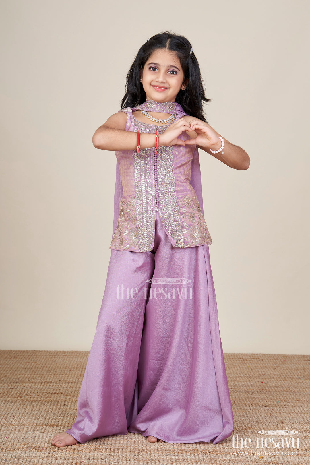 Sleeveless ethnic sharara set with intricate embroidery for festive occasions