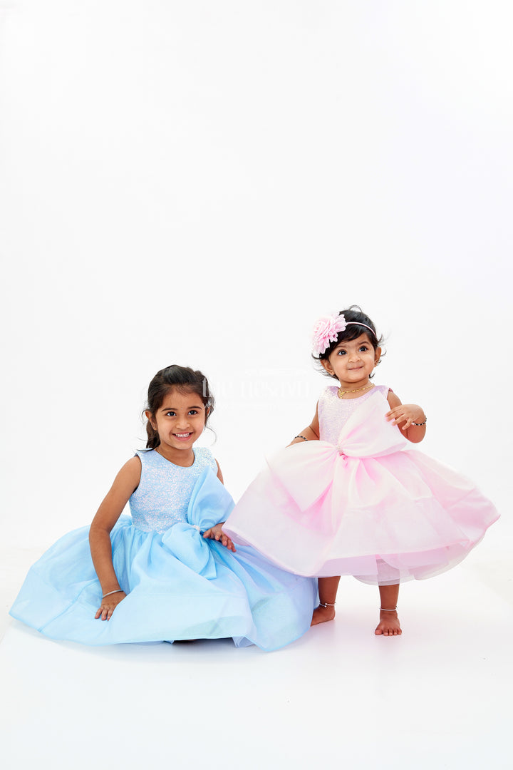Baby Girls Fancy Frock in Pink Shimmer Fabric with Oversized Bow and Flared Silhouette