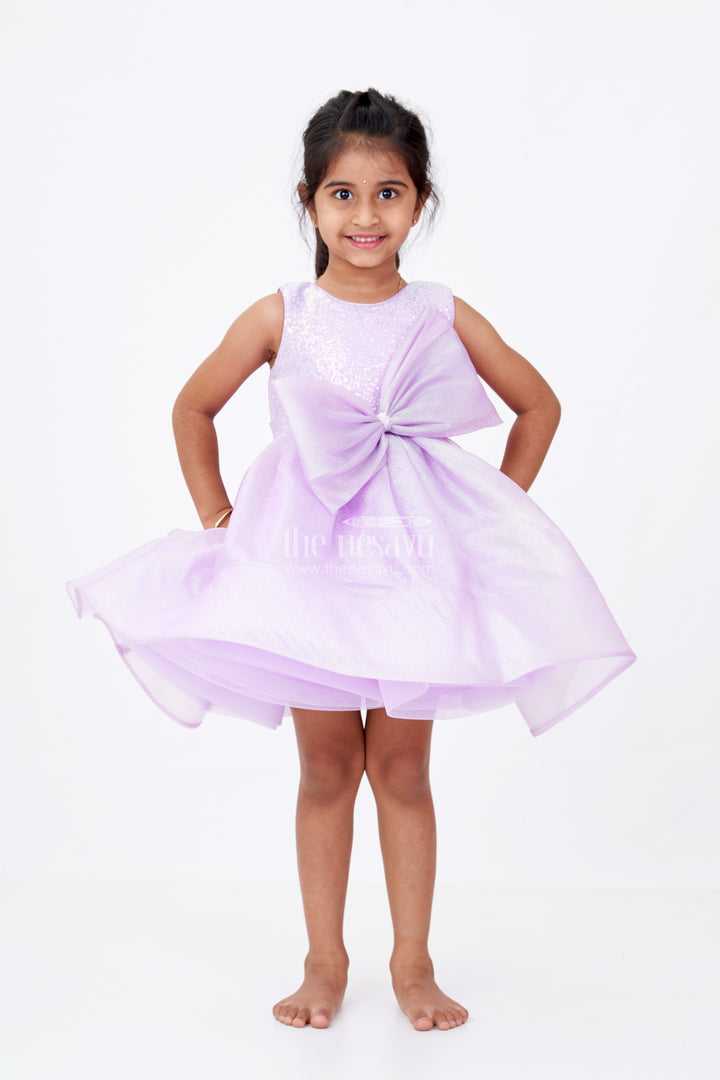 Girls Cotton Party Wear Frock in Lavender Organza with Giant Bow and Glittery Flared Silhouette