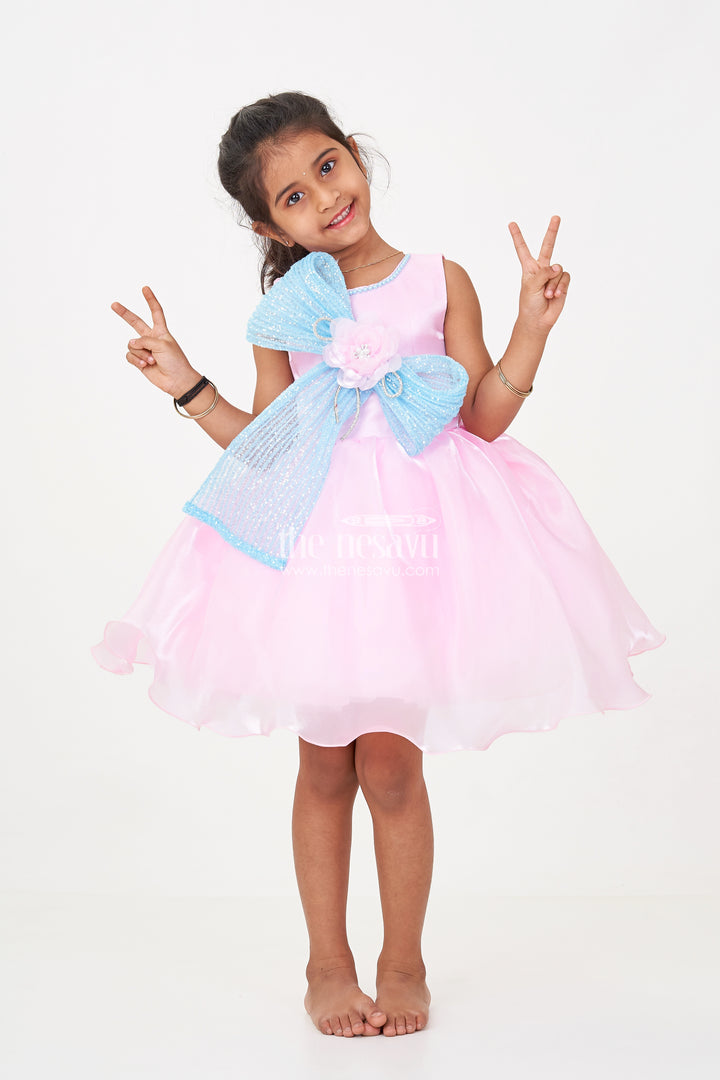 Girls Pink Net Frock with Blue Glitter Bow and Floral Accent in Glazed Organza Fabric