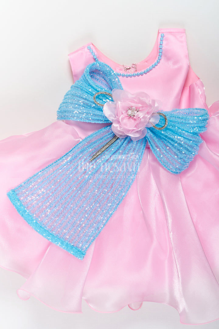 Girls Pink Net Frock with Blue Glitter Bow and Floral Accent in Glazed Organza Fabric
