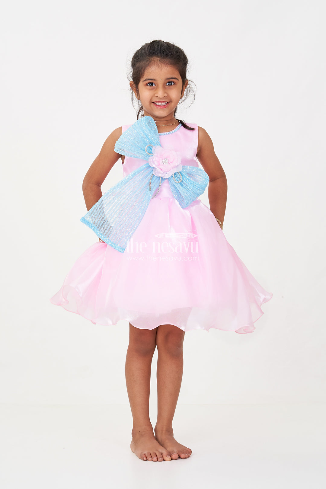 Girls Pink Net Frock with Blue Glitter Bow and Floral Accent in Glazed Organza Fabric
