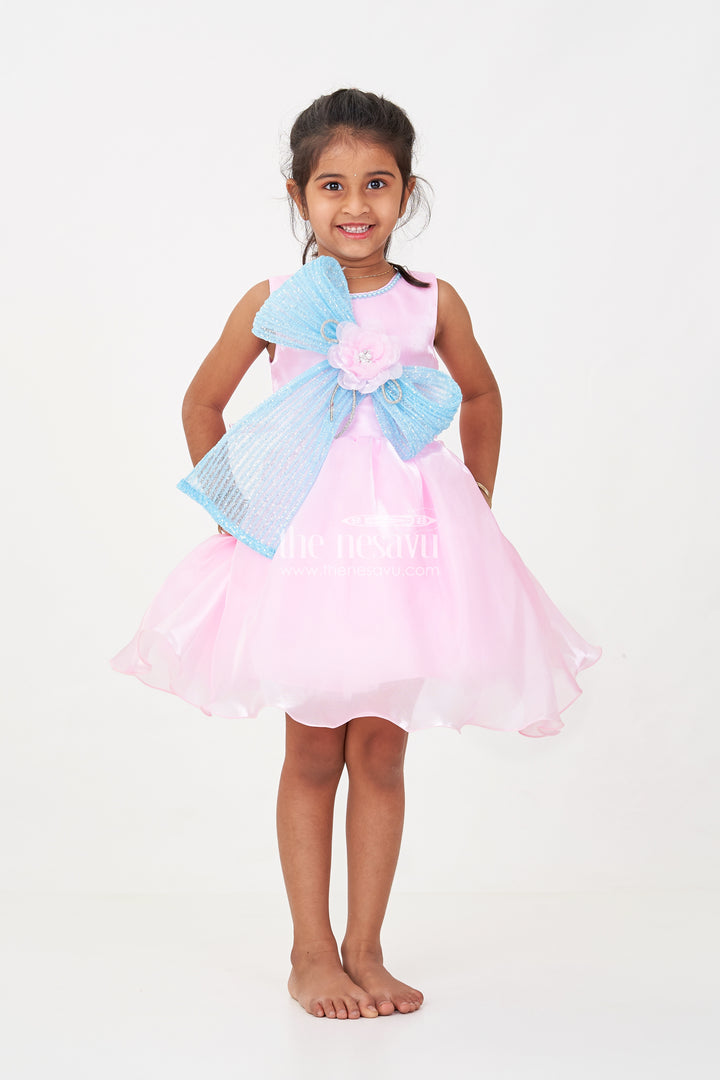 Girls Pink Net Frock with Blue Glitter Bow and Floral Accent in Glazed Organza Fabric