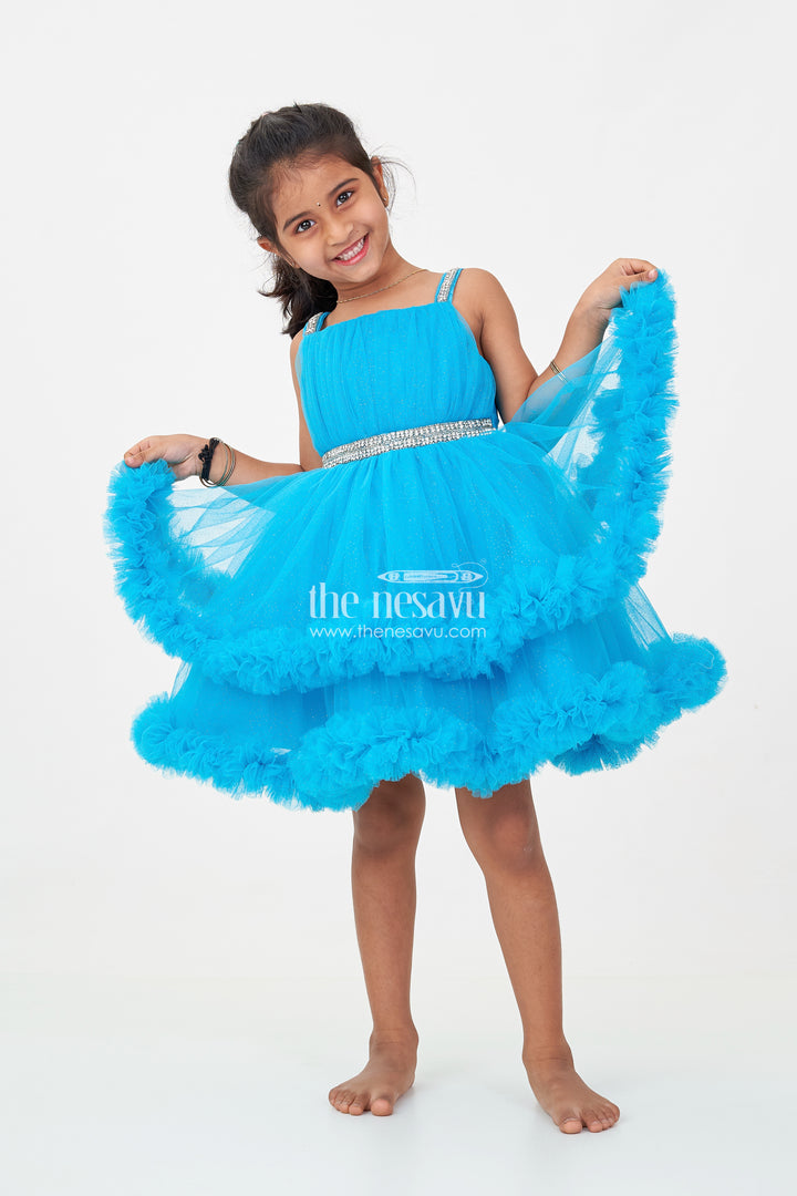 Girls Latest Frock Design in Blue Soft Net with Stone Embellished Belt and Ruffled Skirt