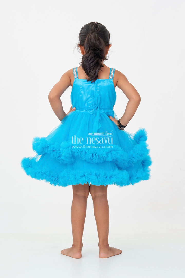 Girls Latest Frock Design in Blue Soft Net with Stone Embellished Belt and Ruffled Skirt