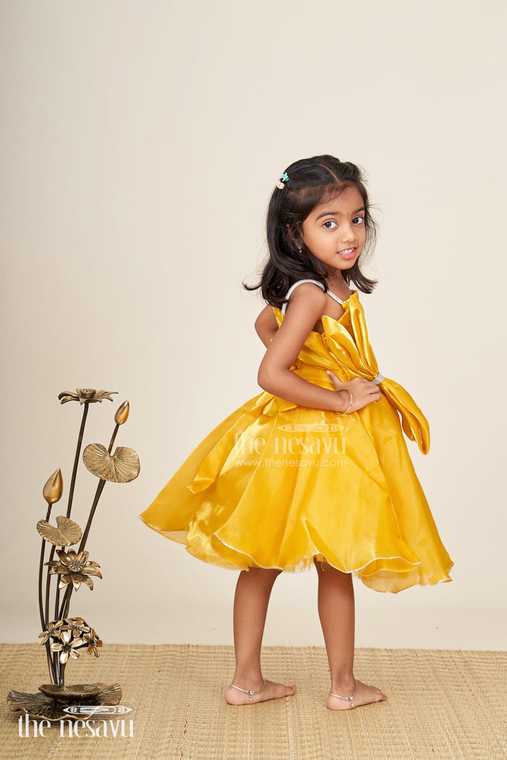 Girls golden satin party frock with bow detail