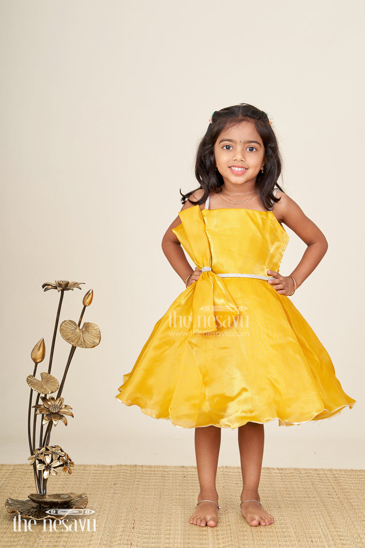 Girls golden satin party frock with bow detail