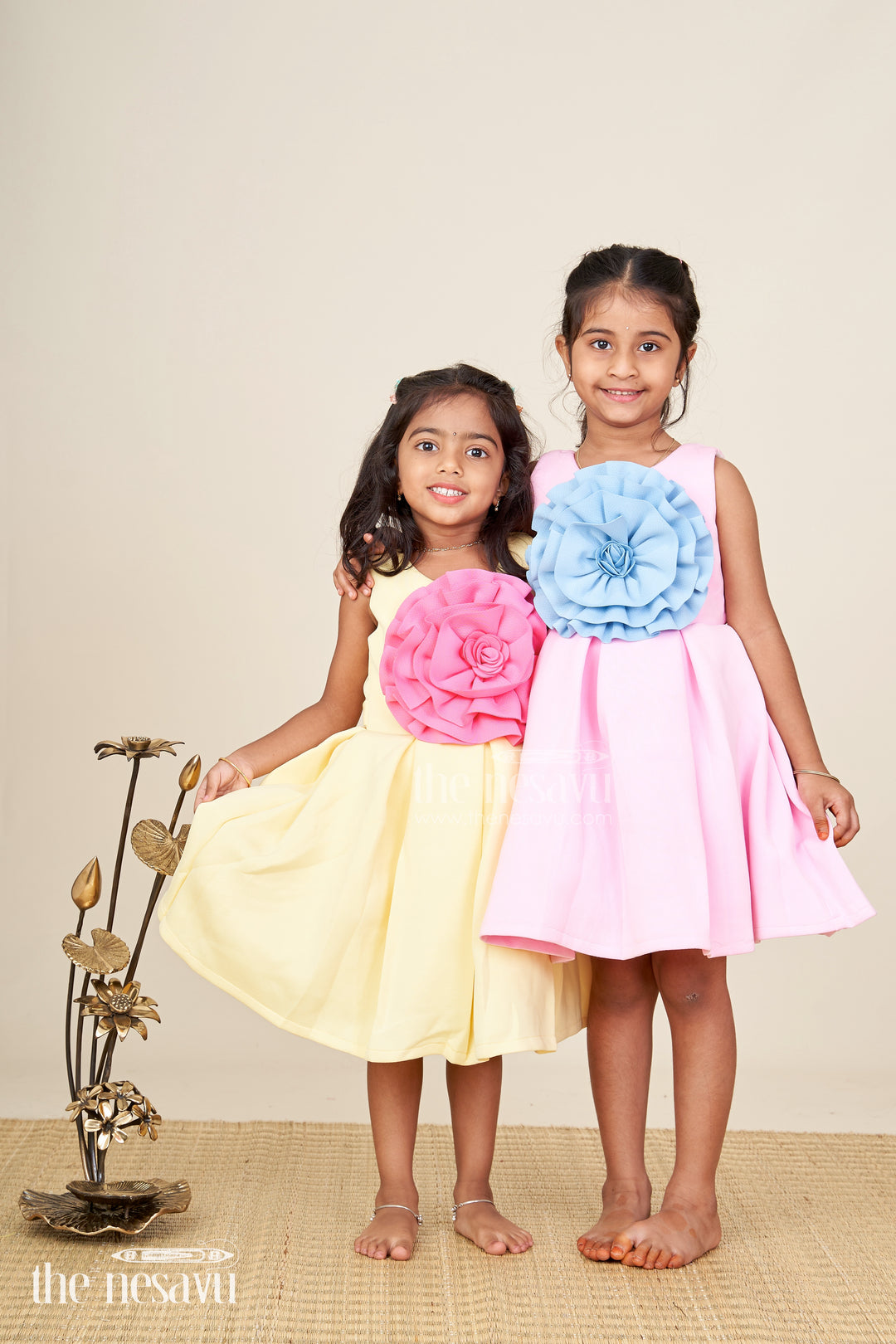 Girls yellow sleeveless party frock with oversized pink flower  birthday special