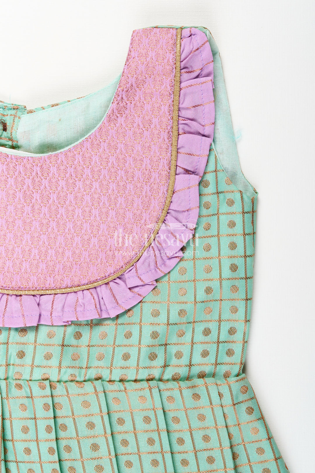 Girls green semi Kanchivaram silk frock with lavender border
