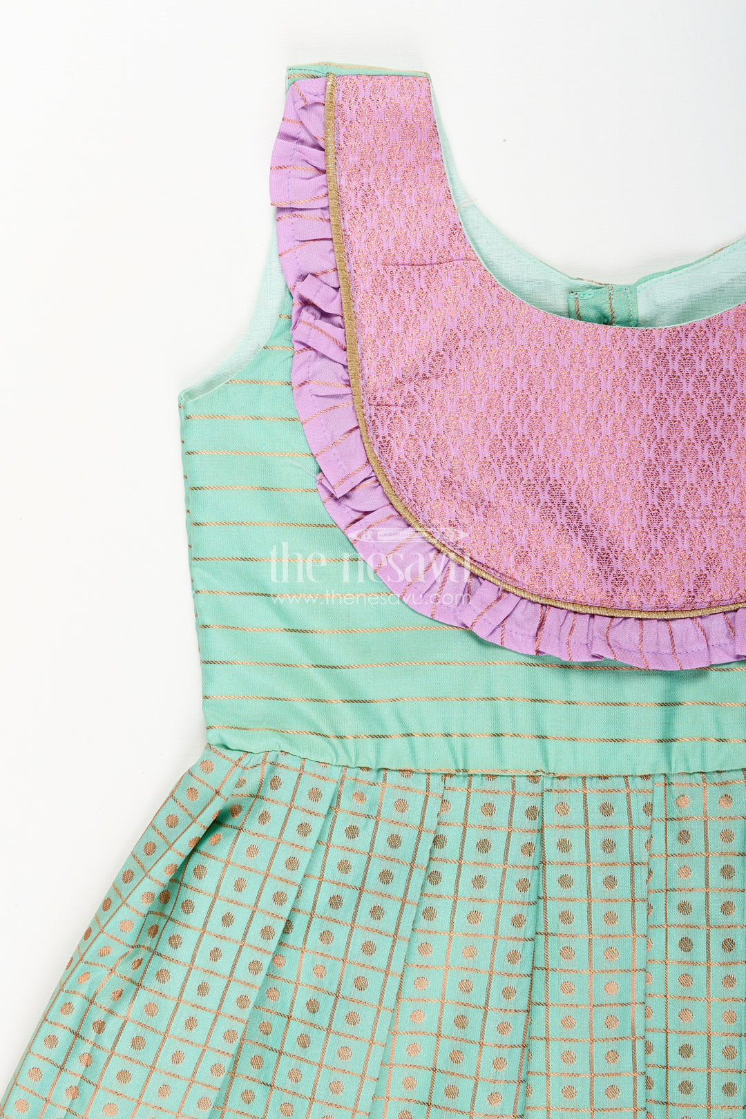 Girls green semi Kanchivaram silk frock with lavender border