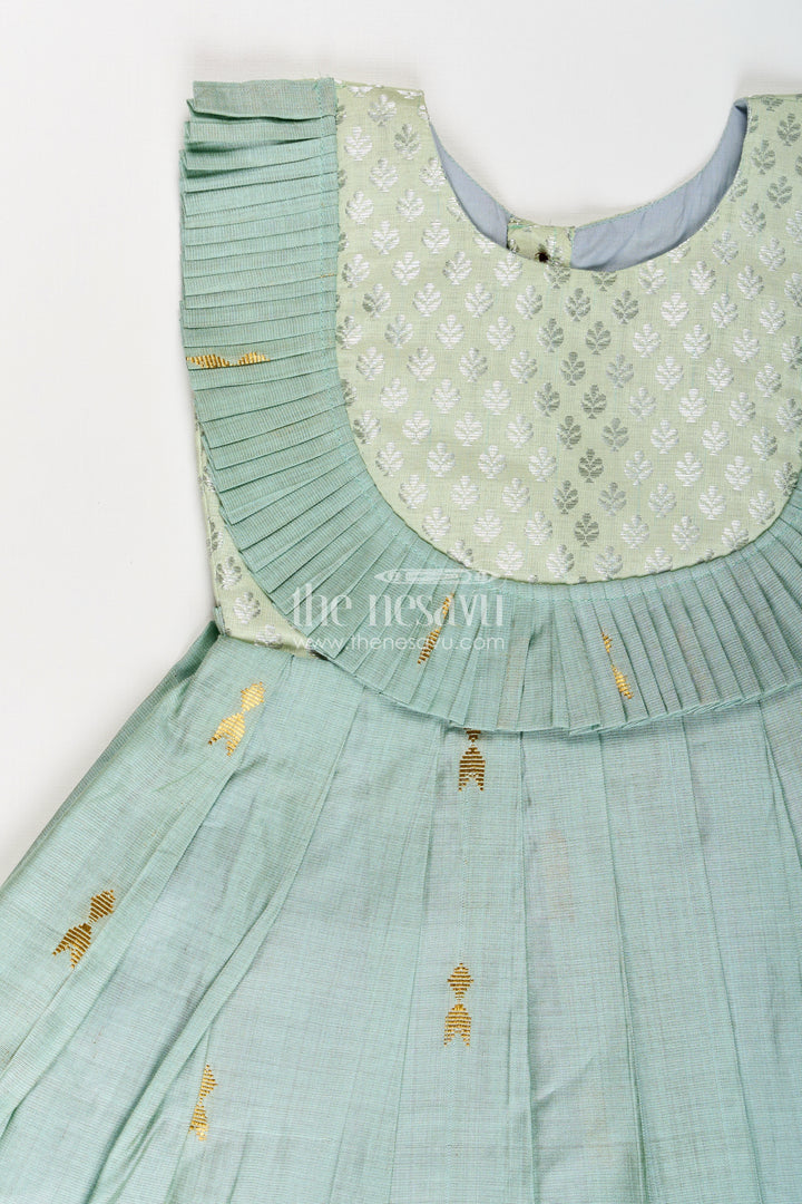 Girls Pattu Long Frocks Designs in Green Viscose with Semi Banaras Yoke and Pleated Details
