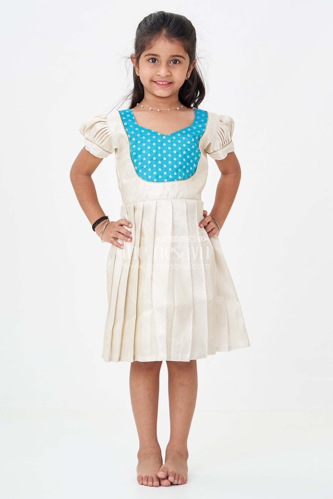 Silk Frock for Baby Girl in Ivory Tissue Silk with Emerald Embellished Yoke and Puff Sleeves