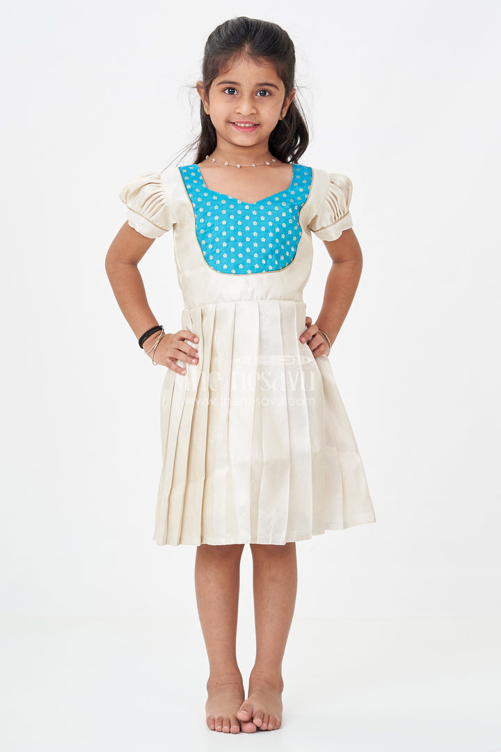 Silk Frock for Baby Girl in Ivory Tissue Silk with Emerald Embellished Yoke and Puff Sleeves