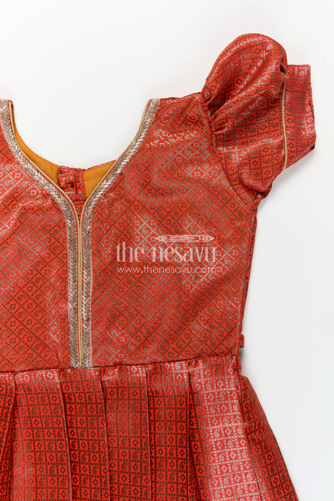 Girls Silk Long Frock Design in Semi Banaras Silk with Rust Orange Zari Brocade and Elegant Pleats