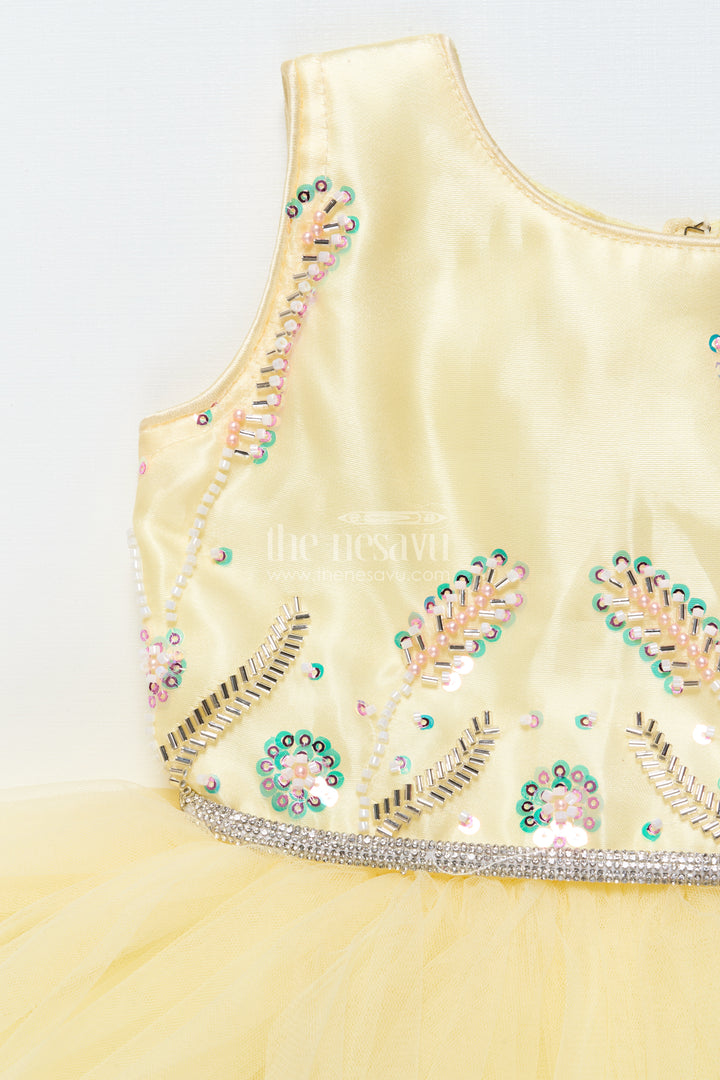 Baby girl party frock with beaded yoke and fluffy net skirt