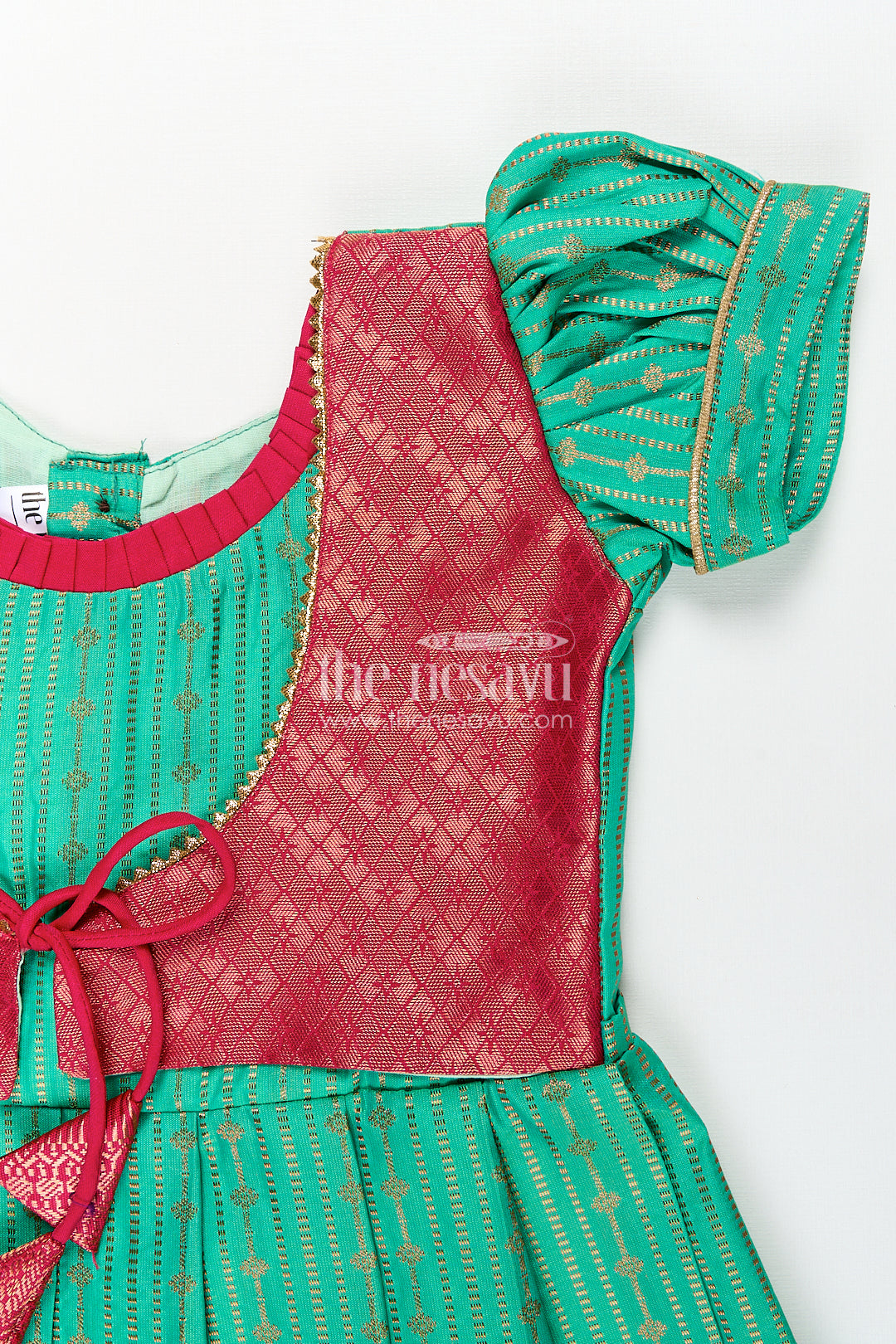 Girls Kanchivaram Silk Design Frock with Puff Sleeves Green Body and Maroon Zari Border Overlay