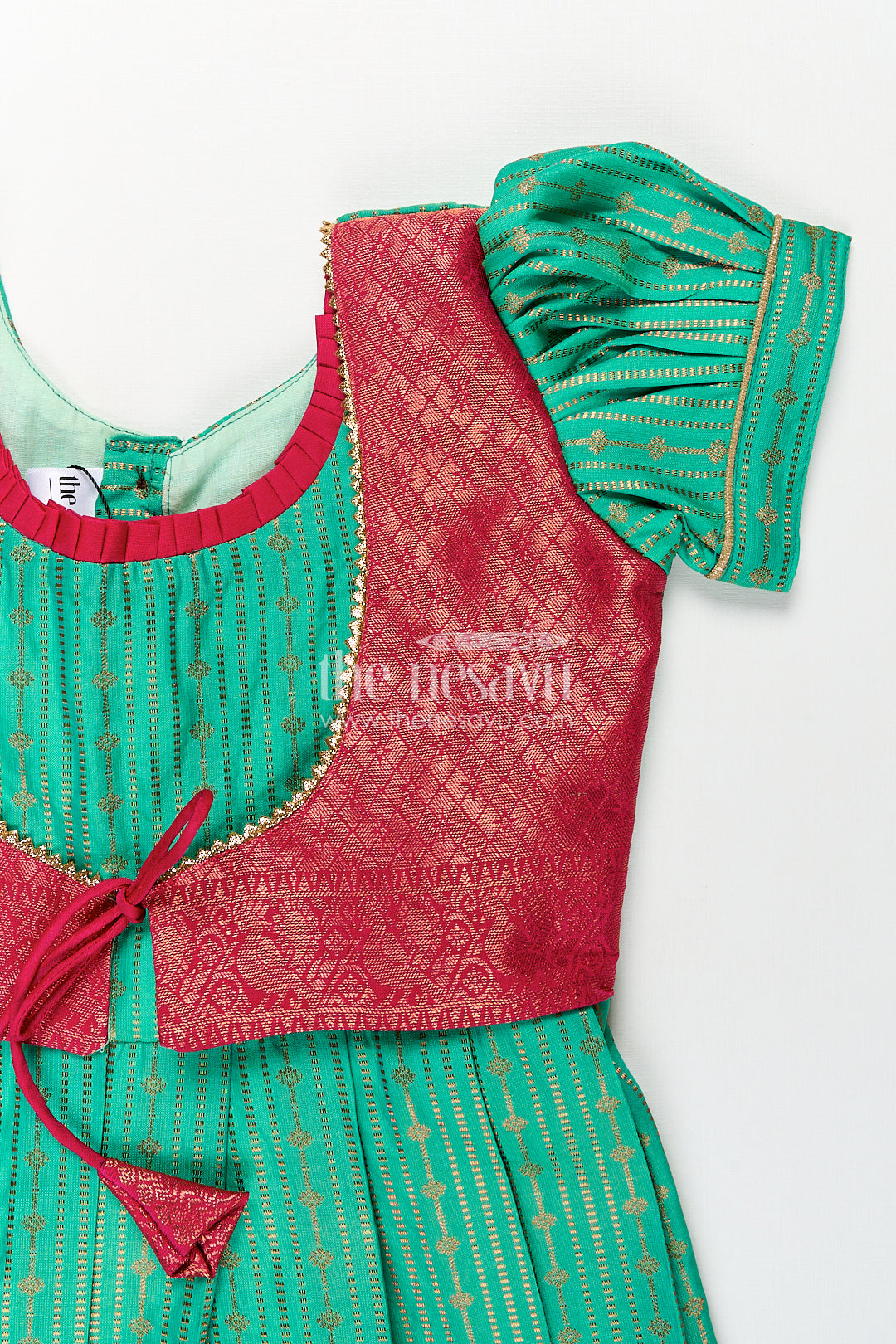 Girls Kanchivaram Silk Design Frock with Puff Sleeves Green Body and Maroon Zari Border Overlay