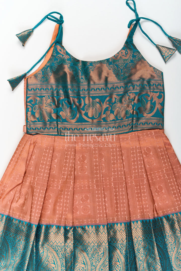 Girls Ethnic Silk Dresses in Semi Kanchivaram with Tie Up Sleeves and Zari Woven Orange Green Pleated Skirt
