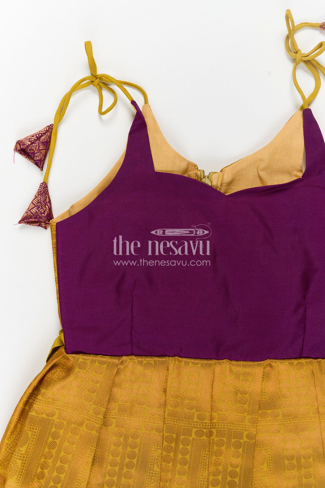 Girls Semi Kanchivaram Silk Long Frocks Designs in Maroon and Mustard with Tie-Up Tassel Straps and Pleated Skirt