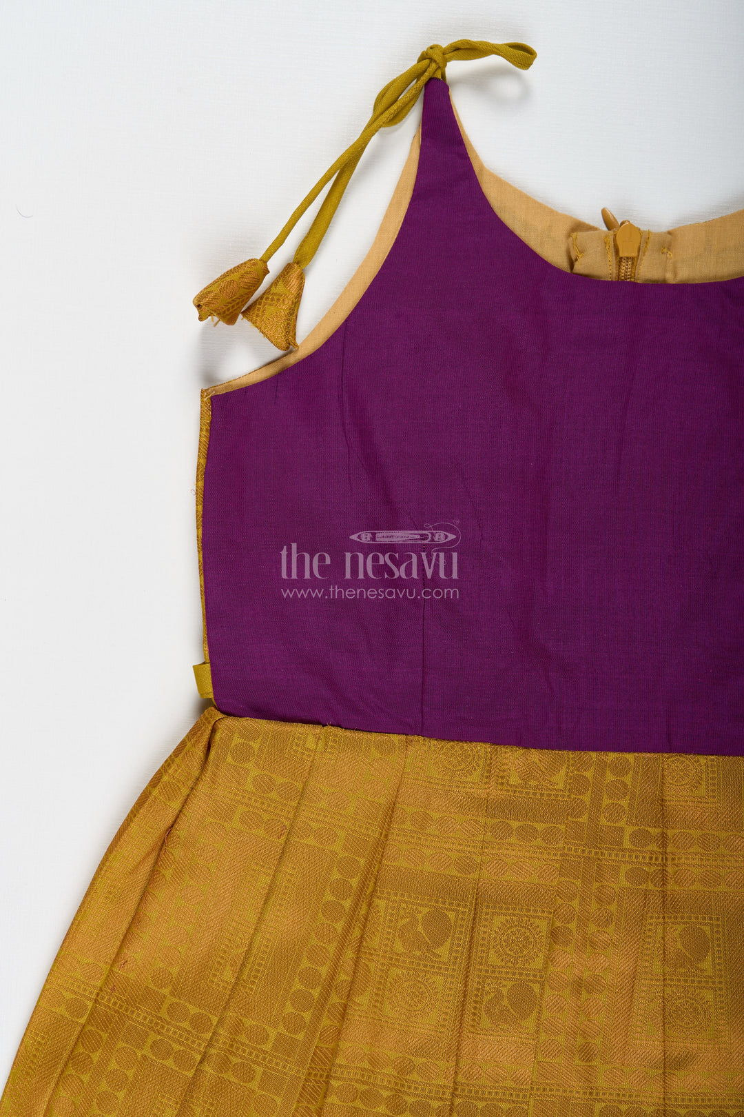 Girls Semi Kanchivaram Silk Long Frocks Designs in Maroon and Mustard with Tie-Up Tassel Straps and Pleated Skirt