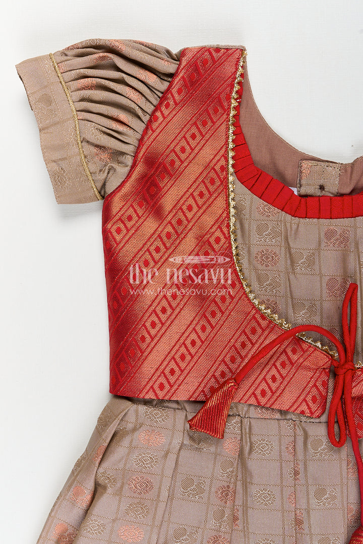 Girls Kanchivaram Soft Silk Frocks with Beige Body Red Puff Sleeves and Rich Zari Woven Hemline