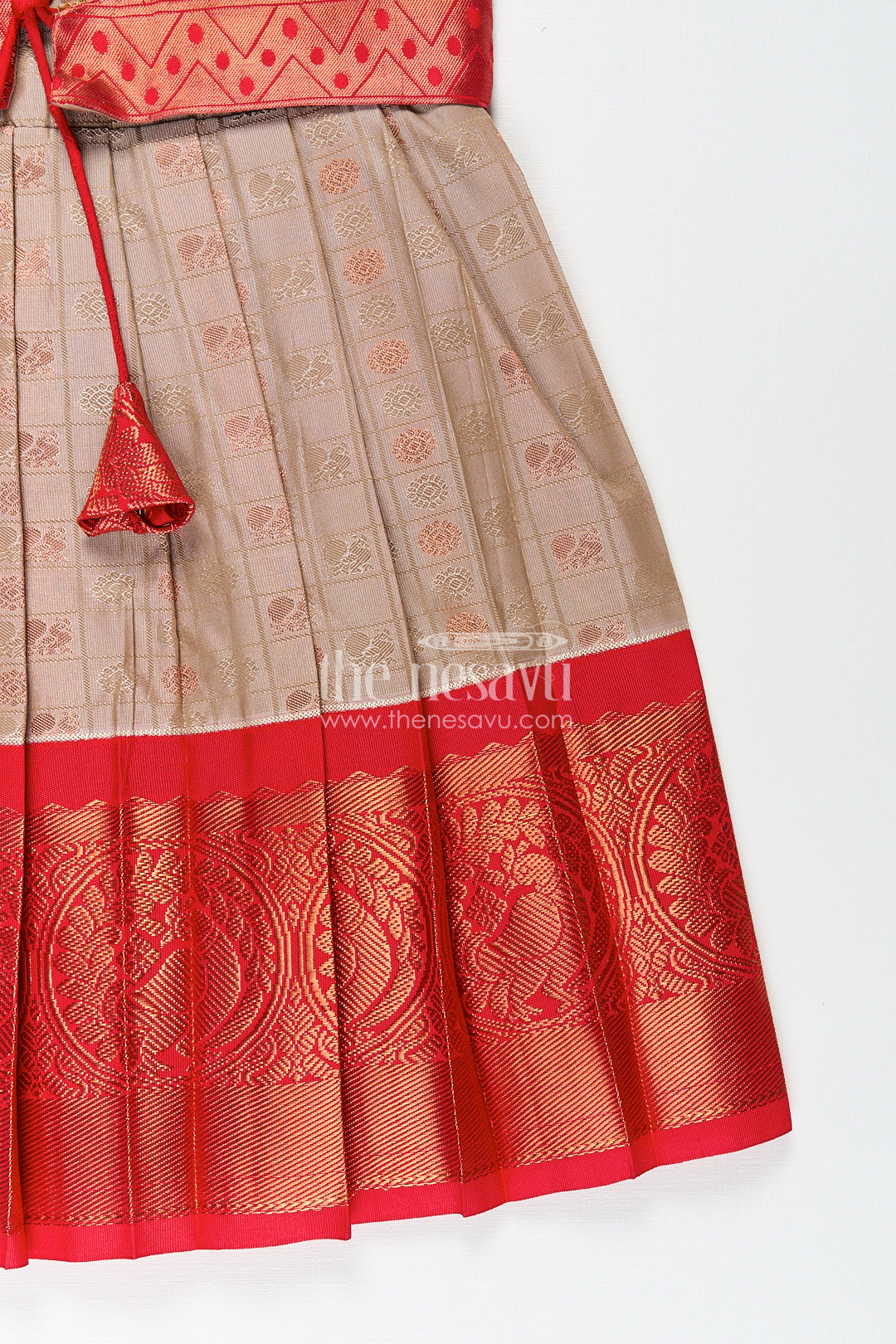 Girls Kanchivaram Soft Silk Frocks with Beige Body Red Puff Sleeves and Rich Zari Woven Hemline