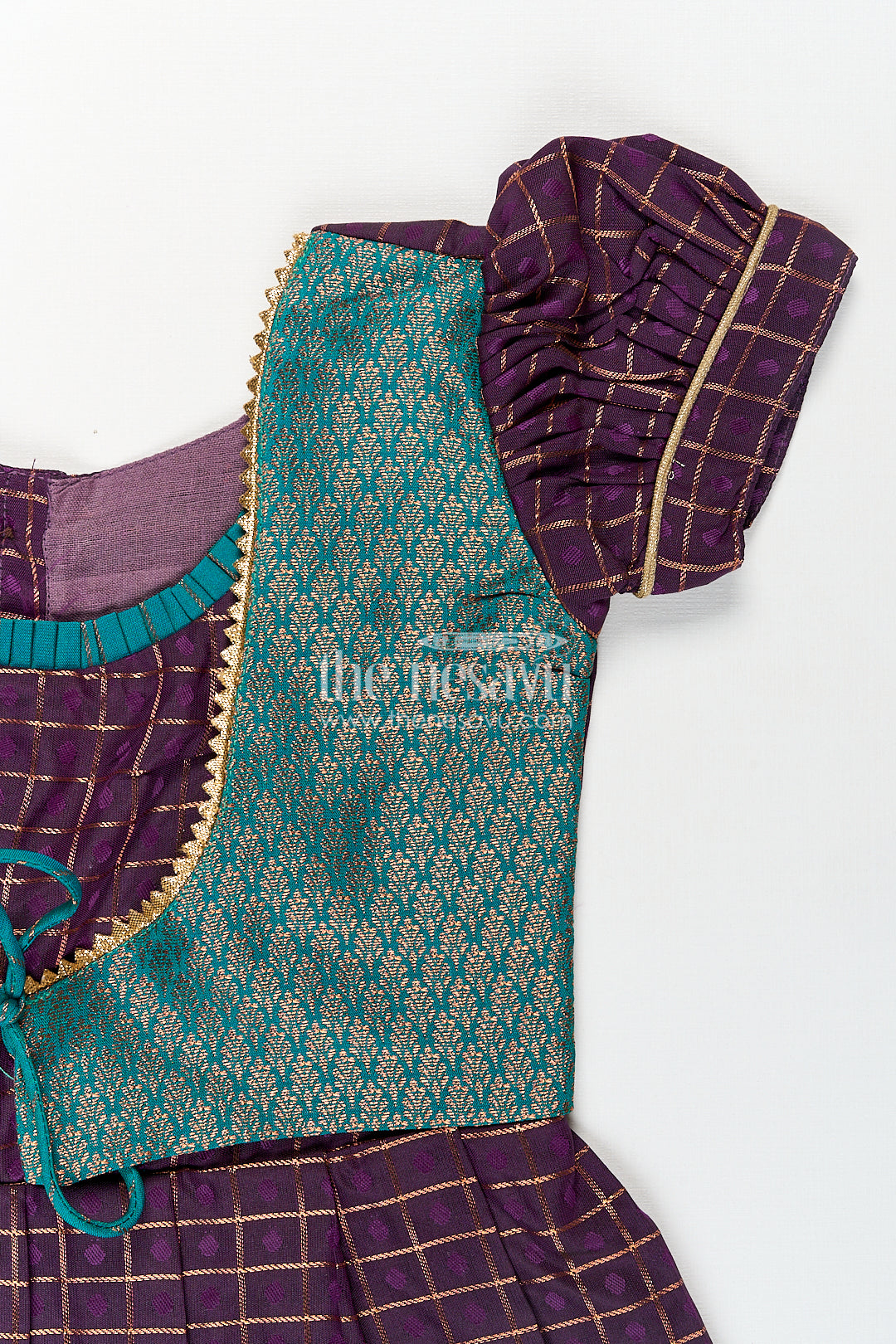Girls Long Silk Frock Design in Semi Kanchivaram with Green Brocade Yoke and Purple Checked Pleated Skirt