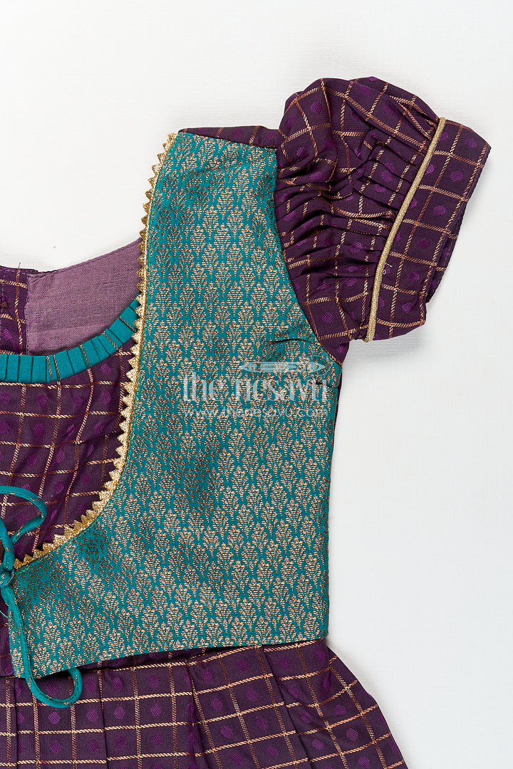Girls Long Silk Frock Design in Semi Kanchivaram with Green Brocade Yoke and Purple Checked Pleated Skirt