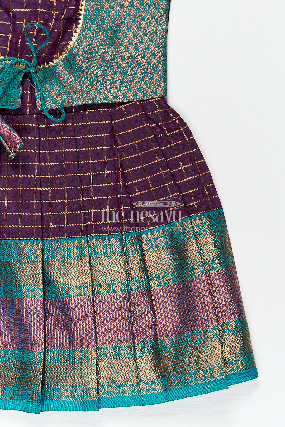 Girls Long Silk Frock Design in Semi Kanchivaram with Green Brocade Yoke and Purple Checked Pleated Skirt