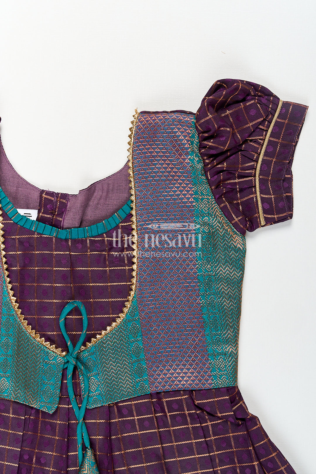 Girls Long Silk Frock Design in Semi Kanchivaram with Green Brocade Yoke and Purple Checked Pleated Skirt