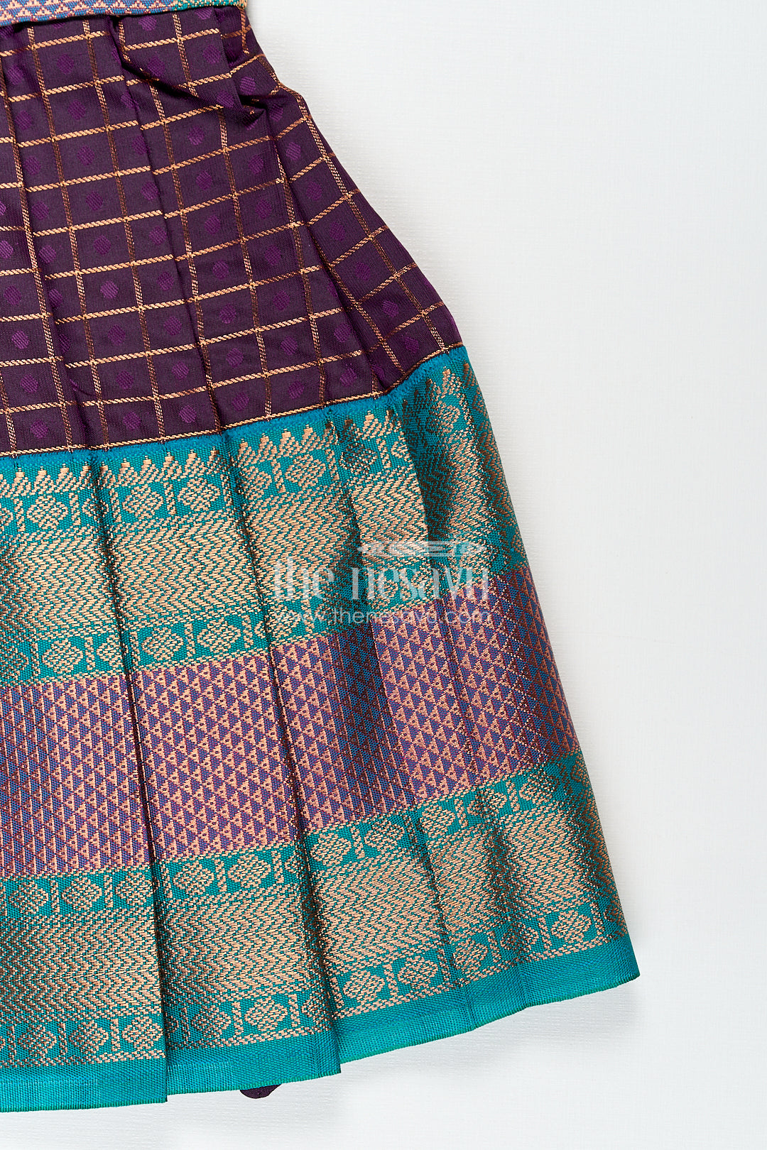 Girls Long Silk Frock Design in Semi Kanchivaram with Green Brocade Yoke and Purple Checked Pleated Skirt