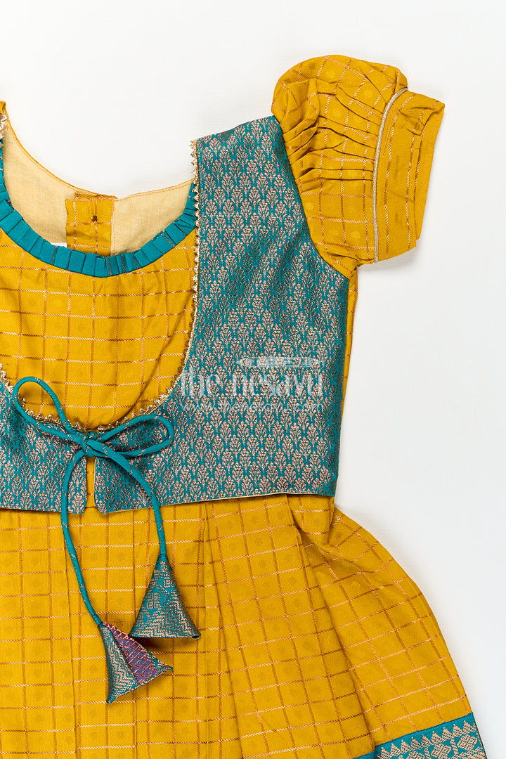 Girls Kanchivaram Ethnic Frocks in Mustard Yellow with Green Zari Overlay and Traditional Border Accents