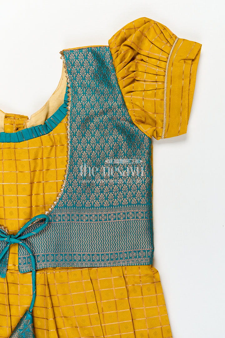 Girls Kanchivaram Ethnic Frocks in Mustard Yellow with Green Zari Overlay and Traditional Border Accents