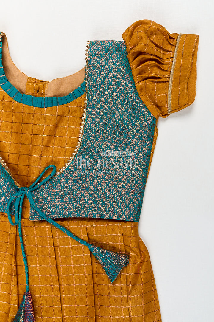 Girls Kanchivaram Orange Silk Frocks with Puff Sleeves Green Zari Overlay and Traditional Woven Border