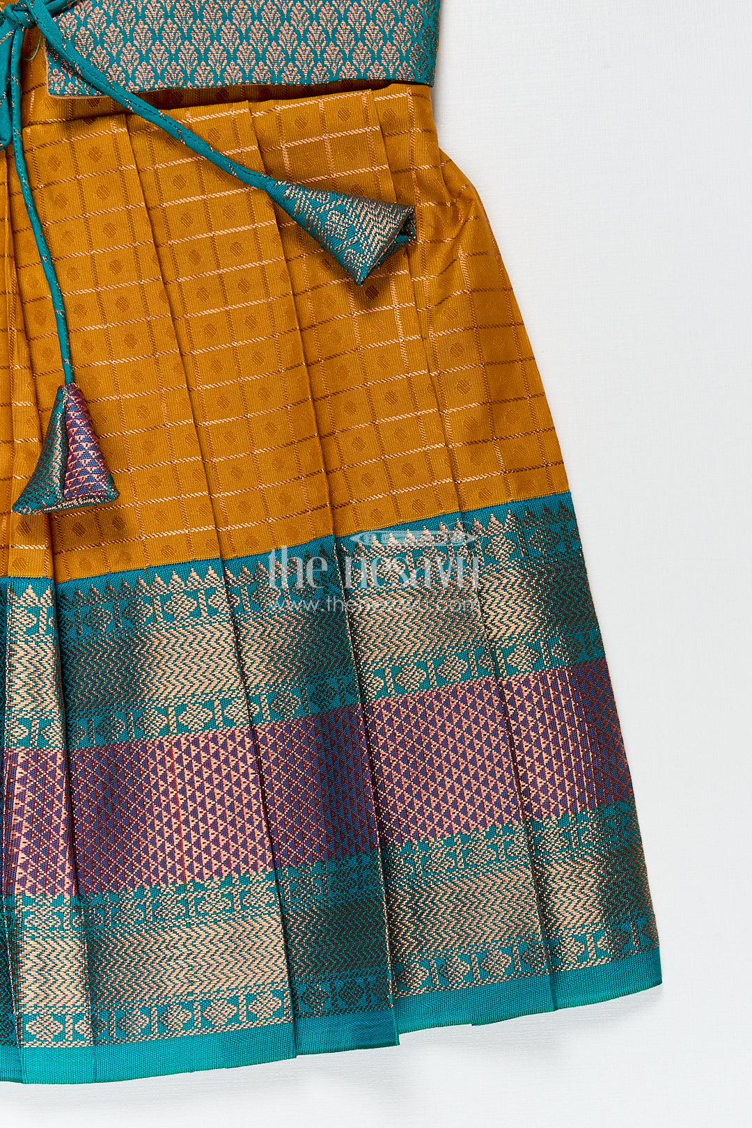 Girls Kanchivaram Orange Silk Frocks with Puff Sleeves Green Zari Overlay and Traditional Woven Border