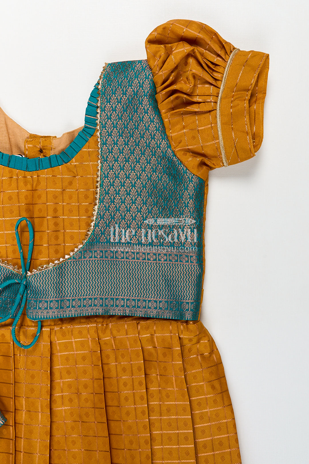 Girls Kanchivaram Orange Silk Frocks with Puff Sleeves Green Zari Overlay and Traditional Woven Border
