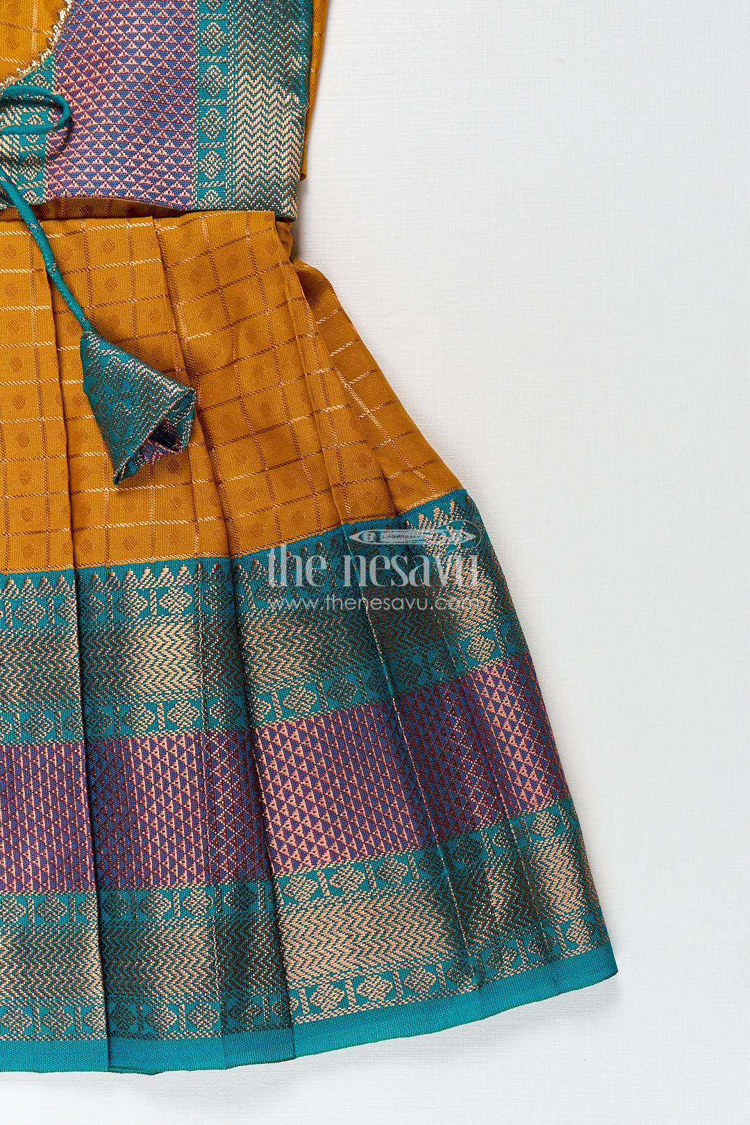 Girls Kanchivaram Orange Silk Frocks with Puff Sleeves Green Zari Overlay and Traditional Woven Border