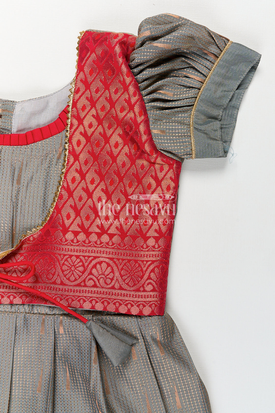 Girls Kanchivaram Long Pattu Frock with Puff Sleeves in Grey Silk and Rich Red Zari Border Finish