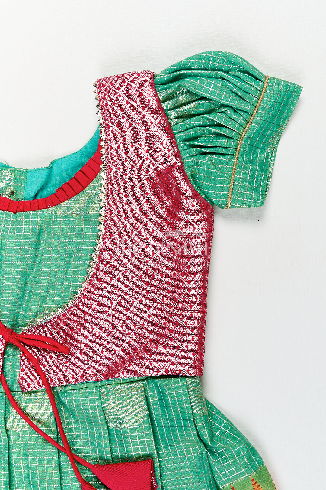 Girls Silk Material Frock Design in Semi Kanchivaram with Green Pleated Skirt and Pink Brocade Yoke