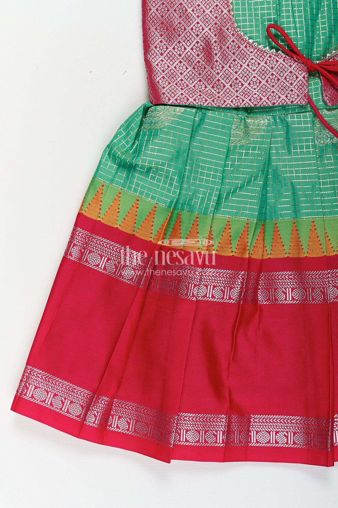 Girls Silk Material Frock Design in Semi Kanchivaram with Green Pleated Skirt and Pink Brocade Yoke