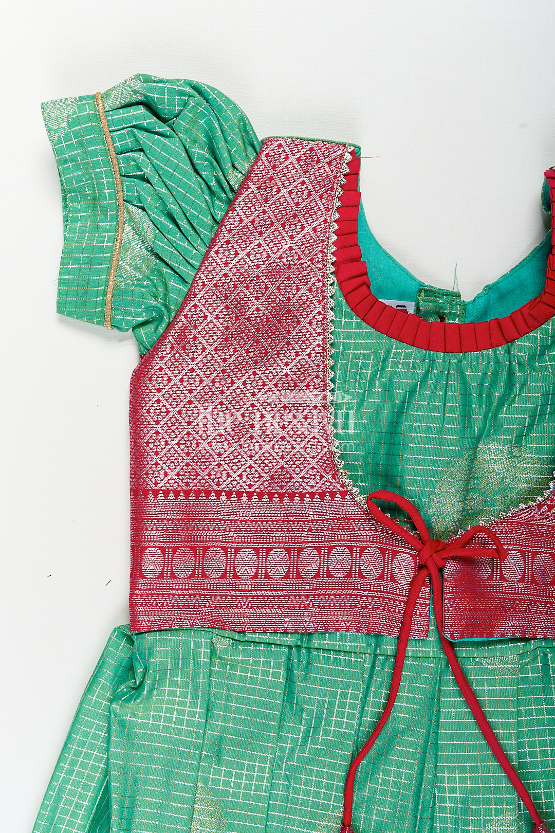 Girls Silk Material Frock Design in Semi Kanchivaram with Green Pleated Skirt and Pink Brocade Yoke