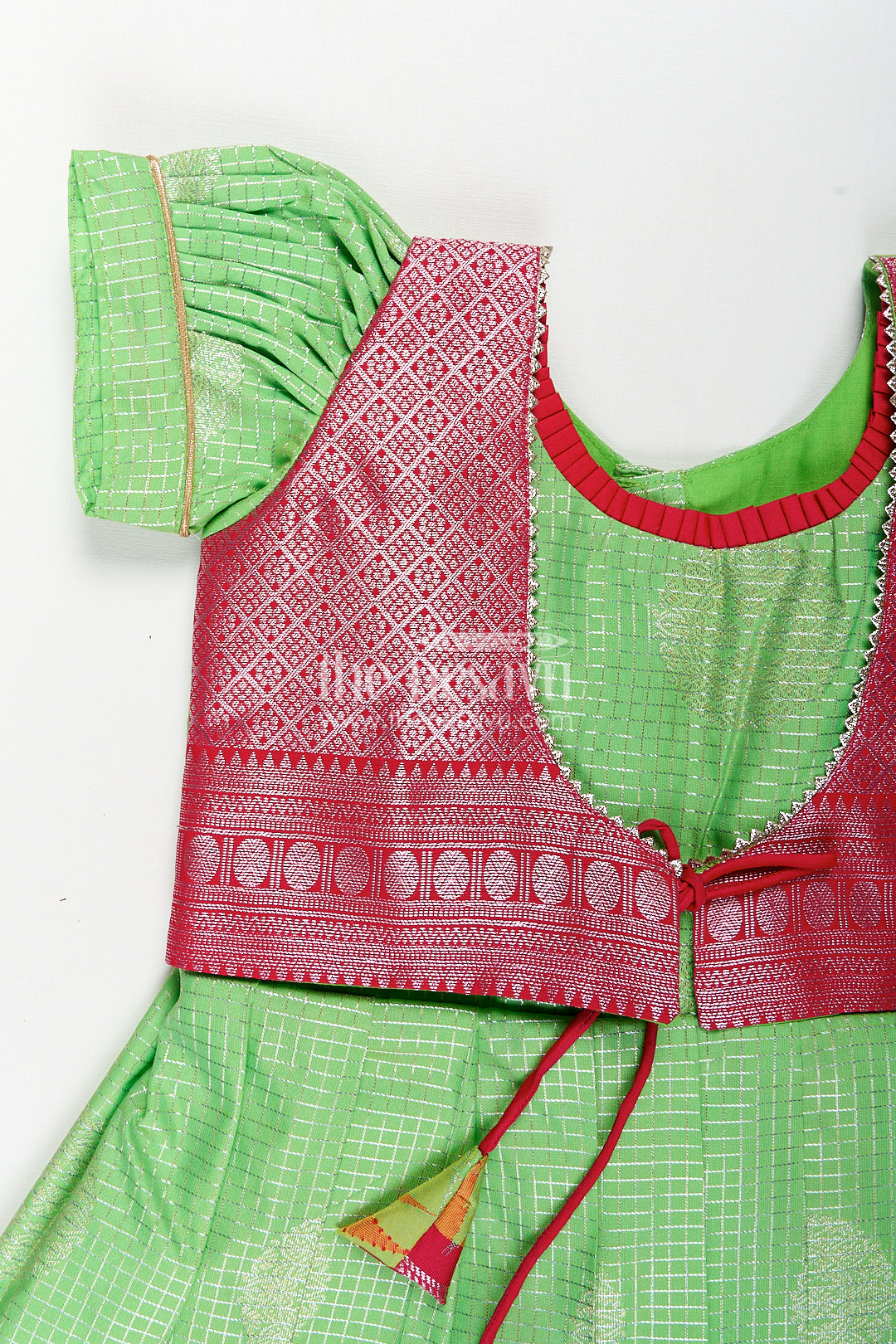 Girls Silky Long Frock in Semi Kanchivaram with Rich Pink Zari Pleats and Green Patterned Bodice
